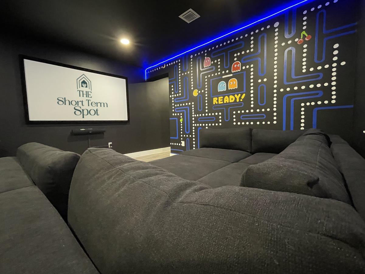 Sink in to the plush theatre seating while watching your favorite movies on the 92" projector screen!